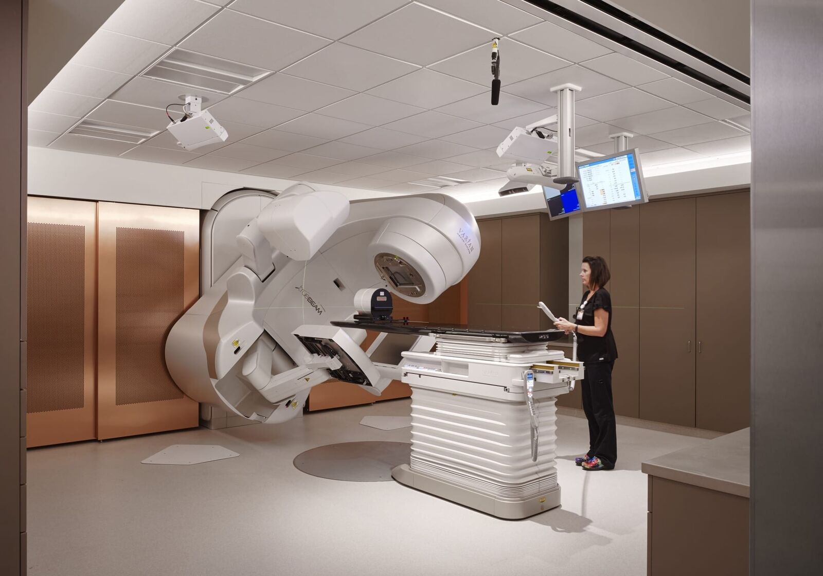 interior room featuring medical equipment and nearby nurse operating machinery