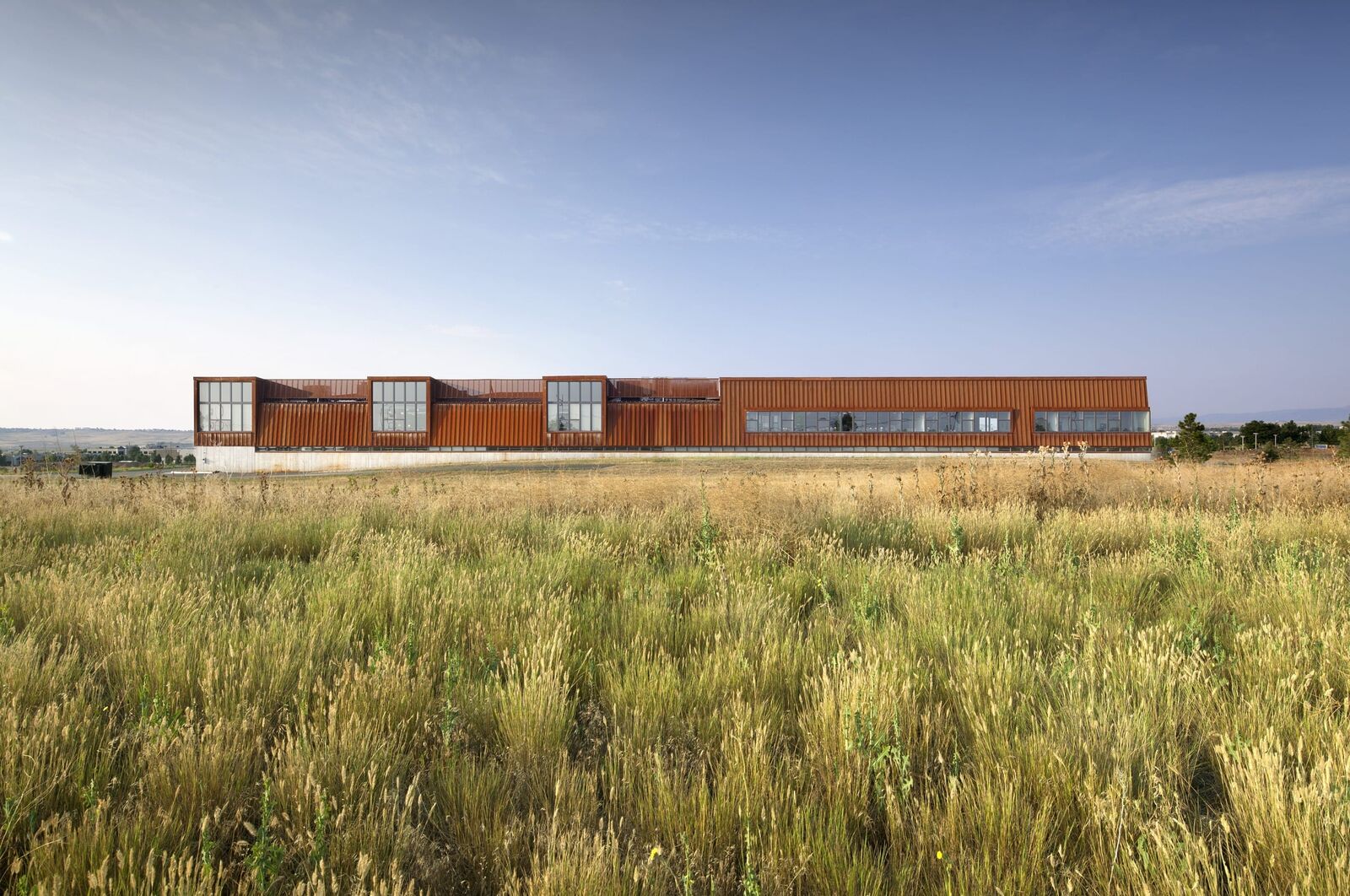 View of the building's exterior façade in a field of grass