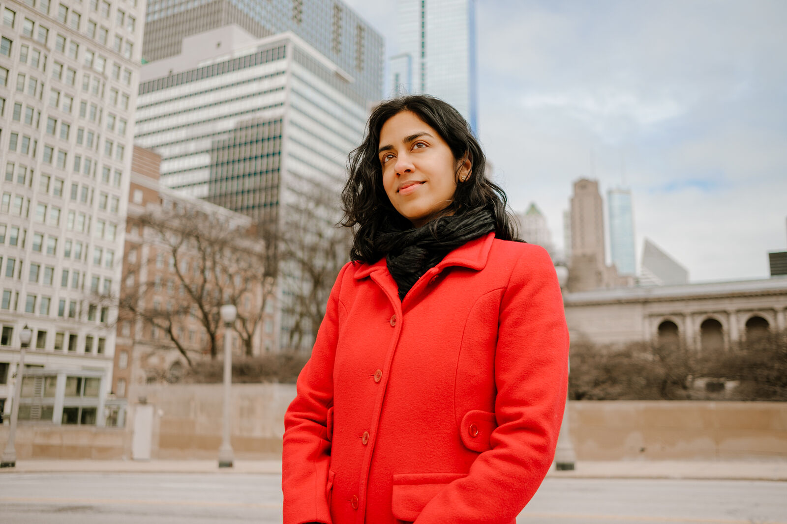 Woman stands in front of Chicago skyline