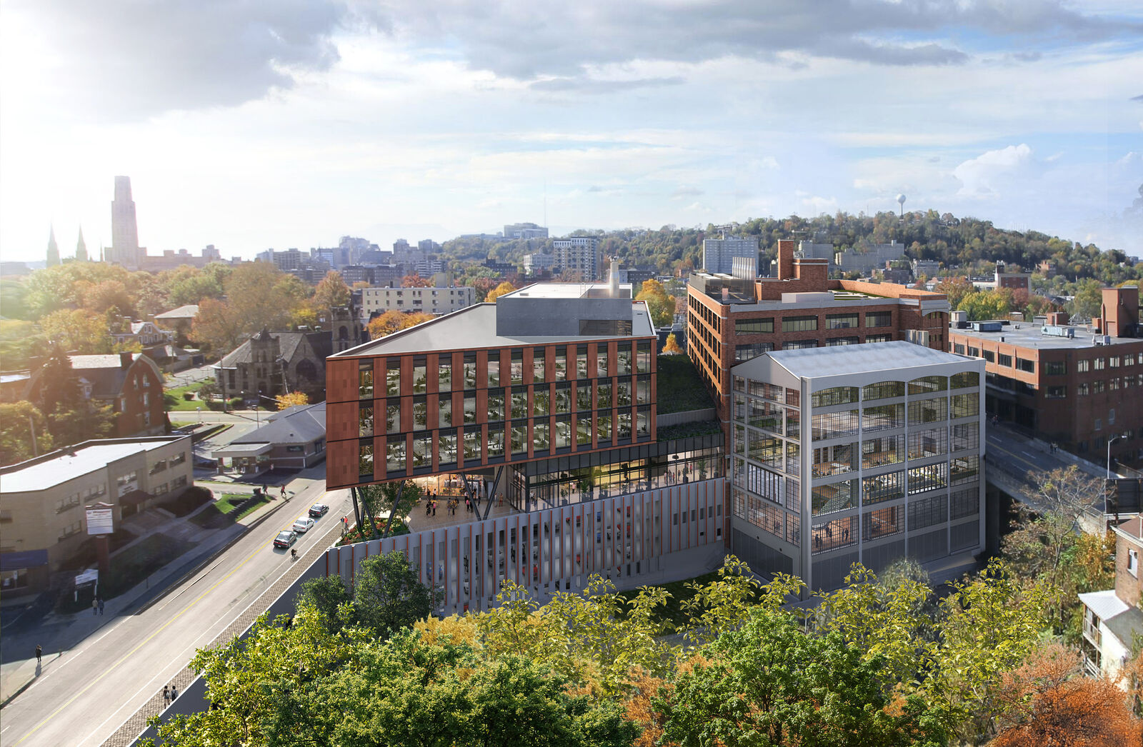 Aerial view of the entire building in front of trees and neighboring buildings