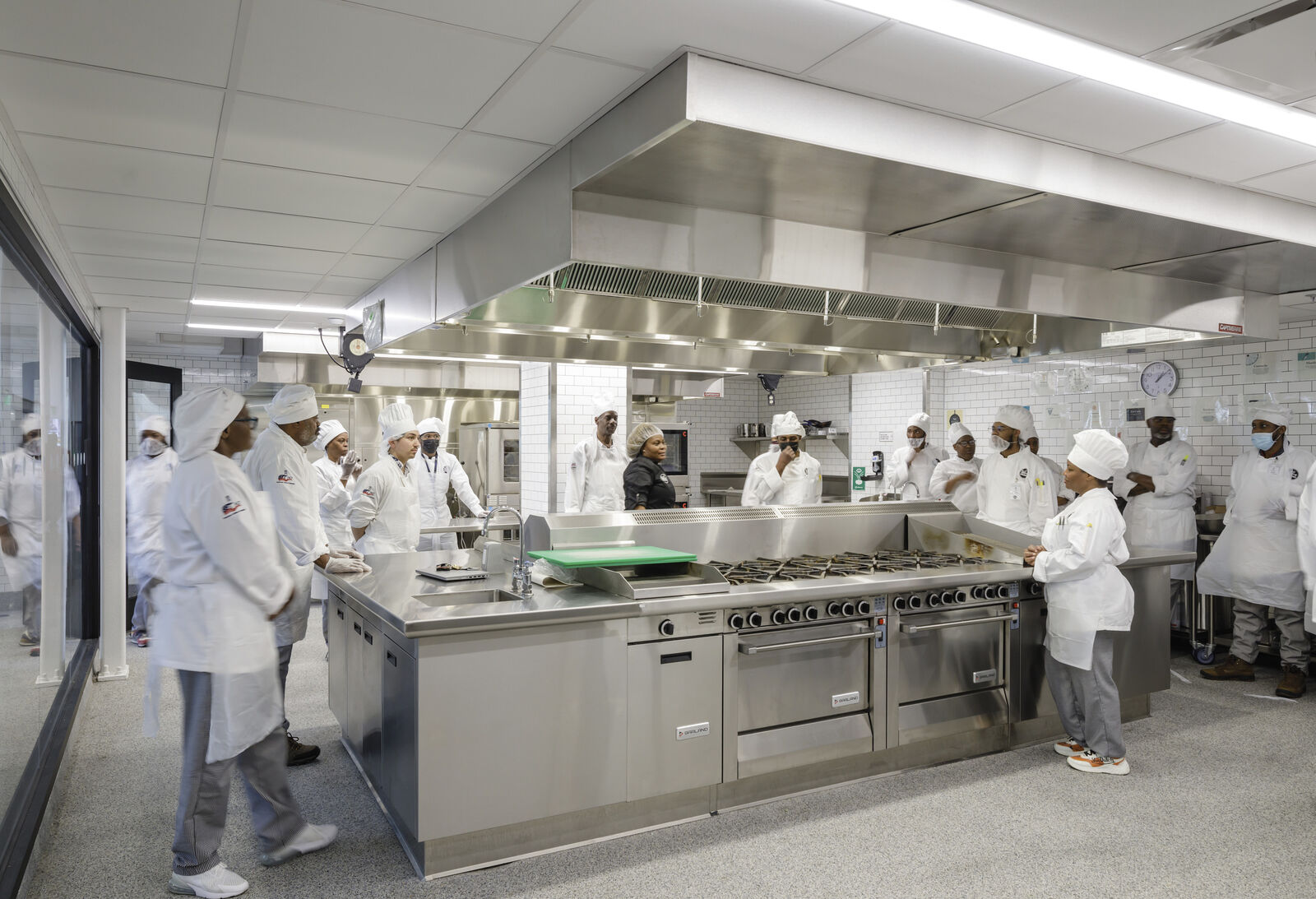 Rendering of people cooking food in kitchen area for DC Central Kitchen 