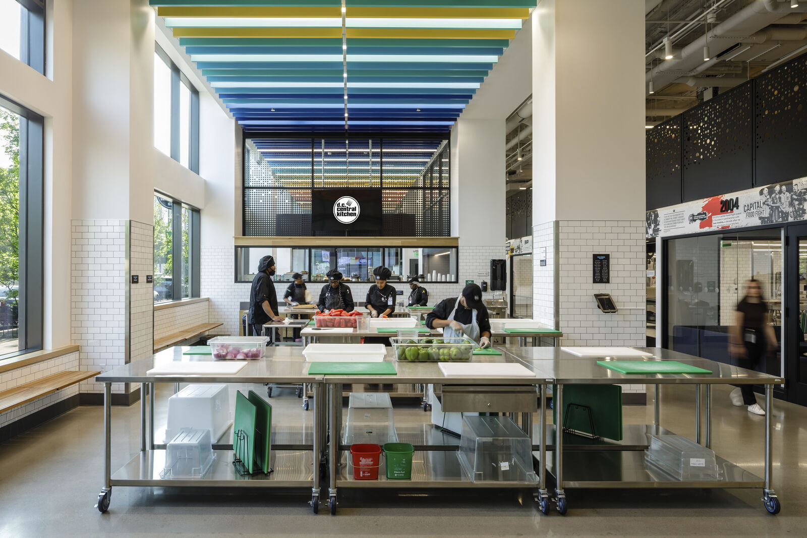 Rendering of people actively working in DC Central Kitchen common area