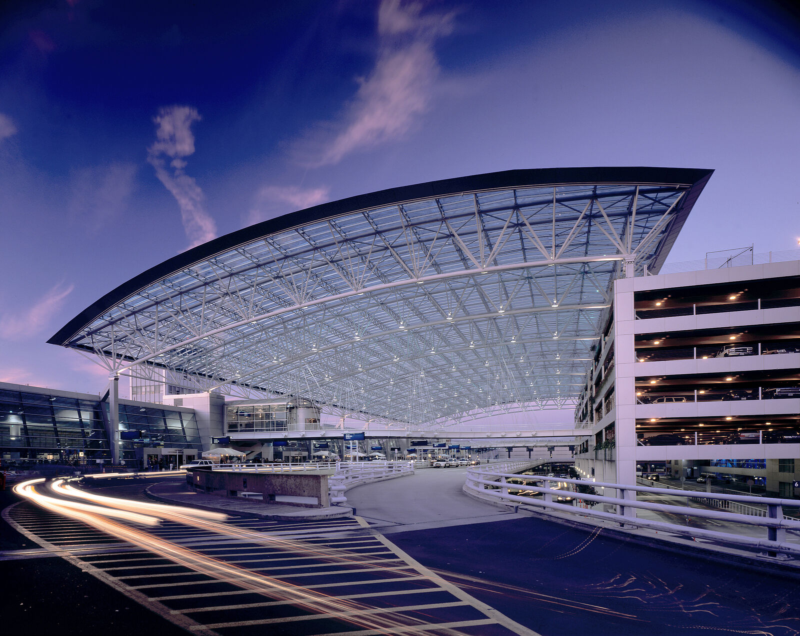A glass canopy at the entrance to PDX