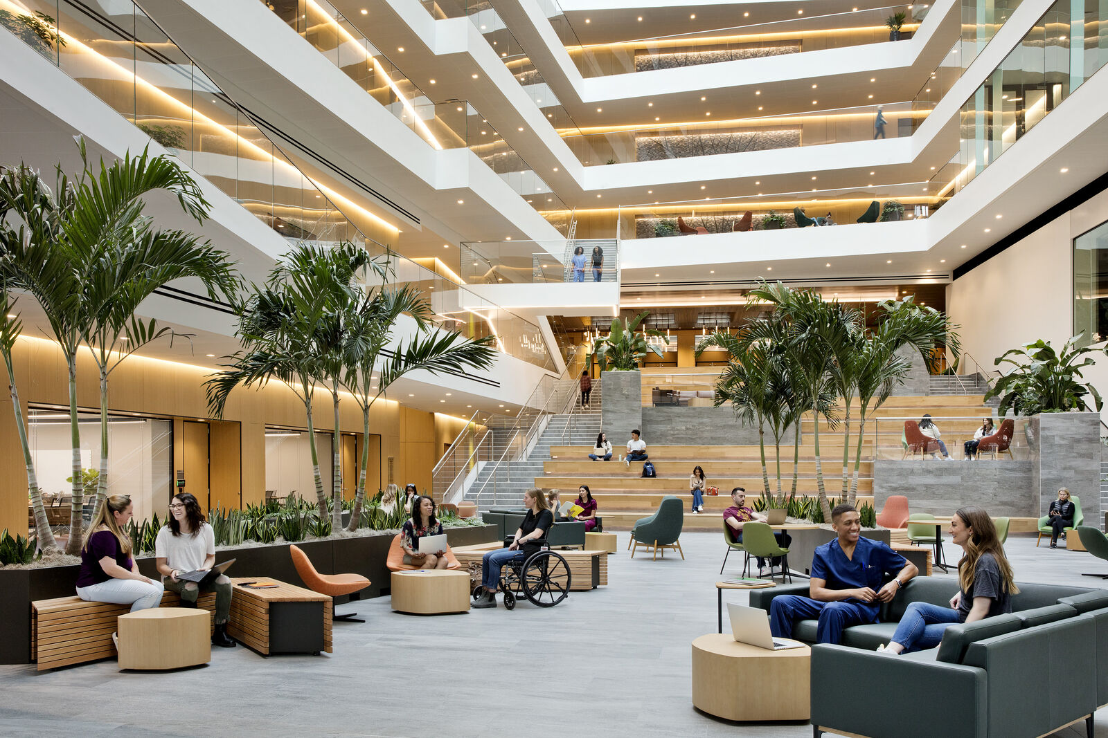 Large populated atrium space with plants