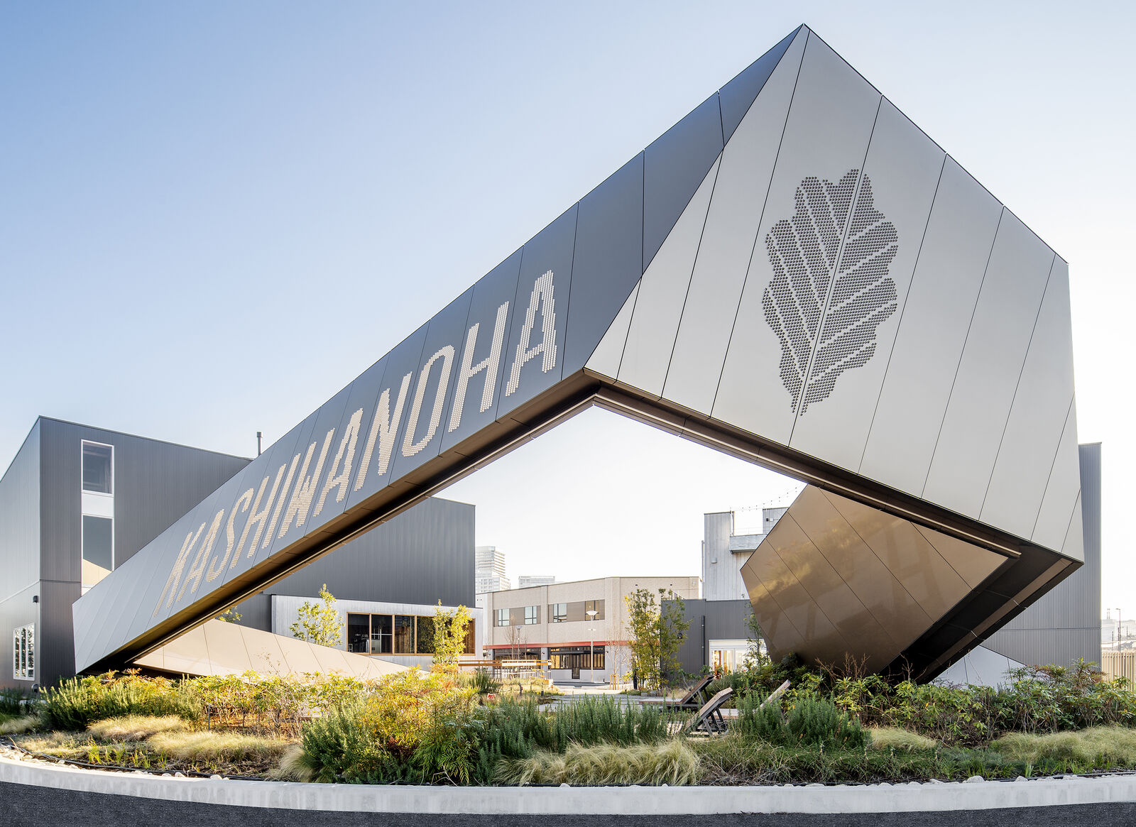 Large metal sign with perforated panels that spells out the word Kashiwanoha