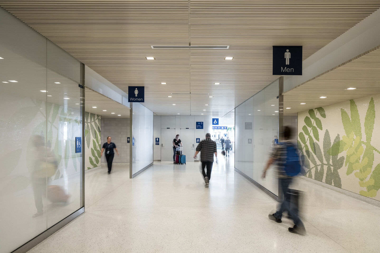 Image of graphic, oversized restroom mosaics of ferns