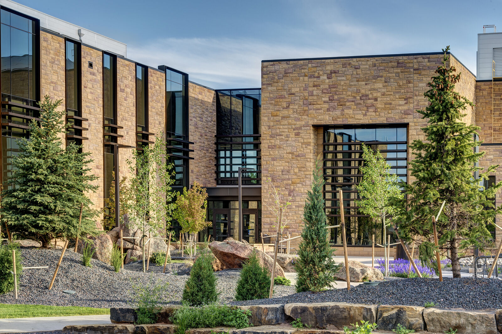 Landscaping elements in front of brick building