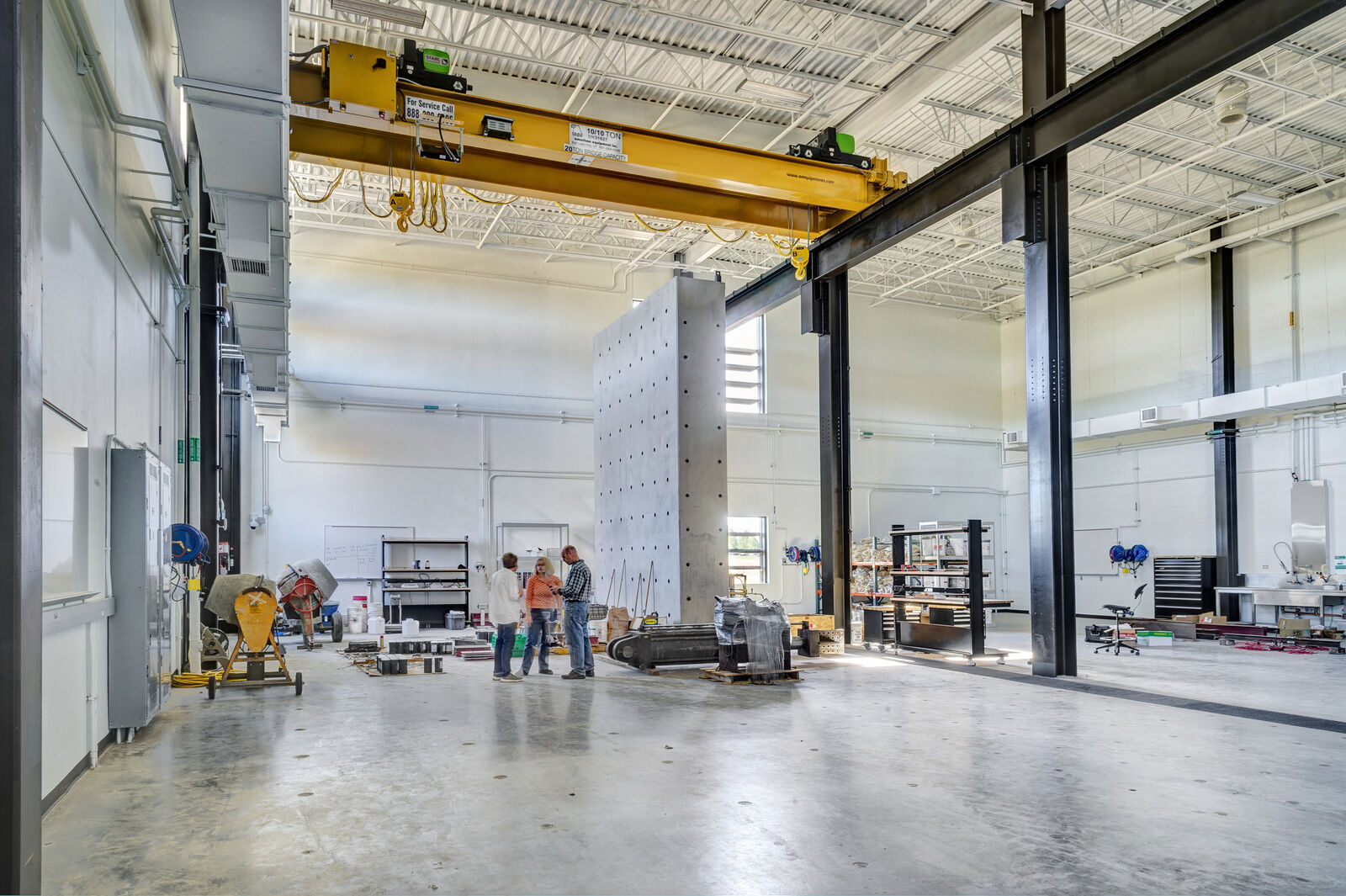People talking in large concrete garage