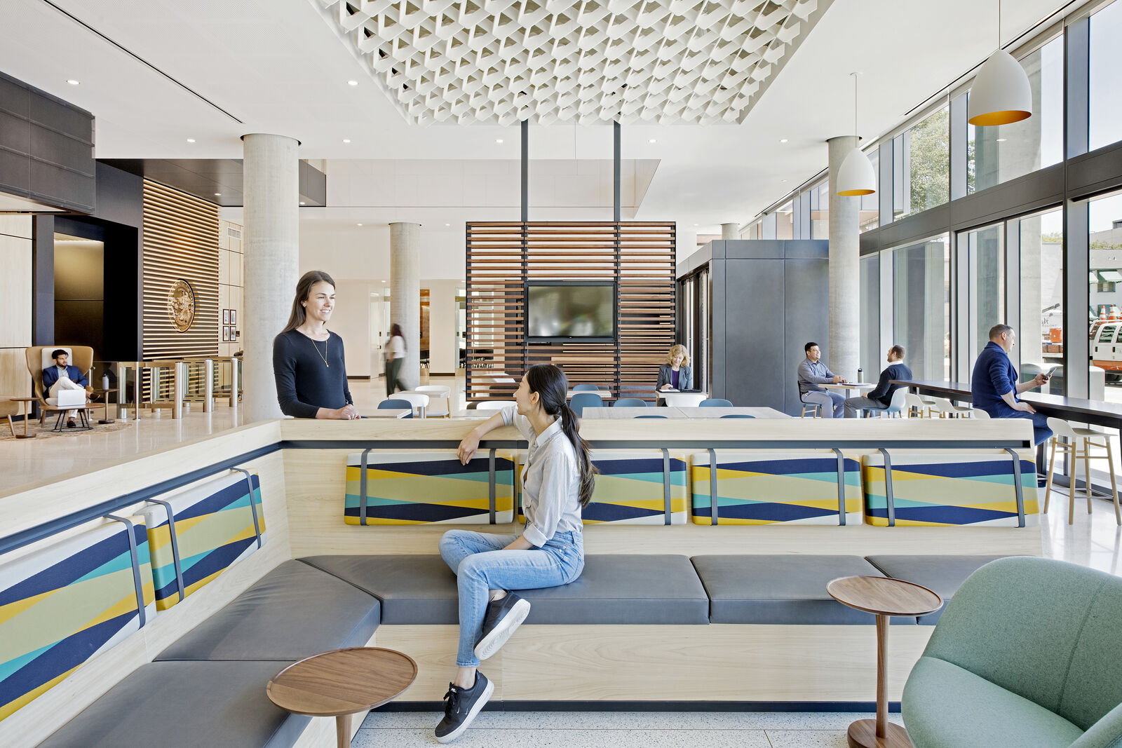 Cafe area with people sitting and talking to each other