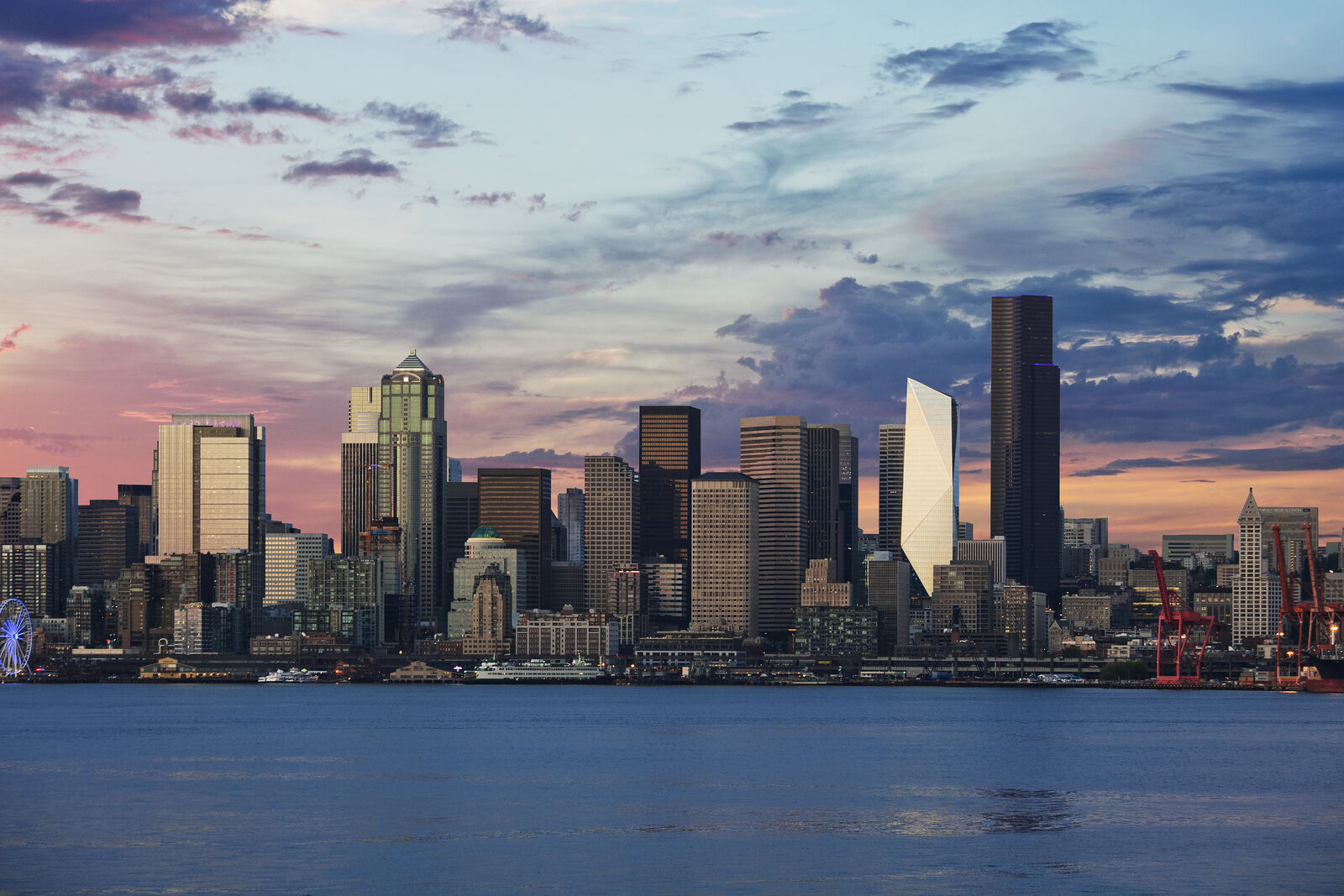 Photo of the Seattle skyline from West Seattle, with light reflecting off the F5 Tower